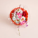 Bouquet di carta cipria e corallo