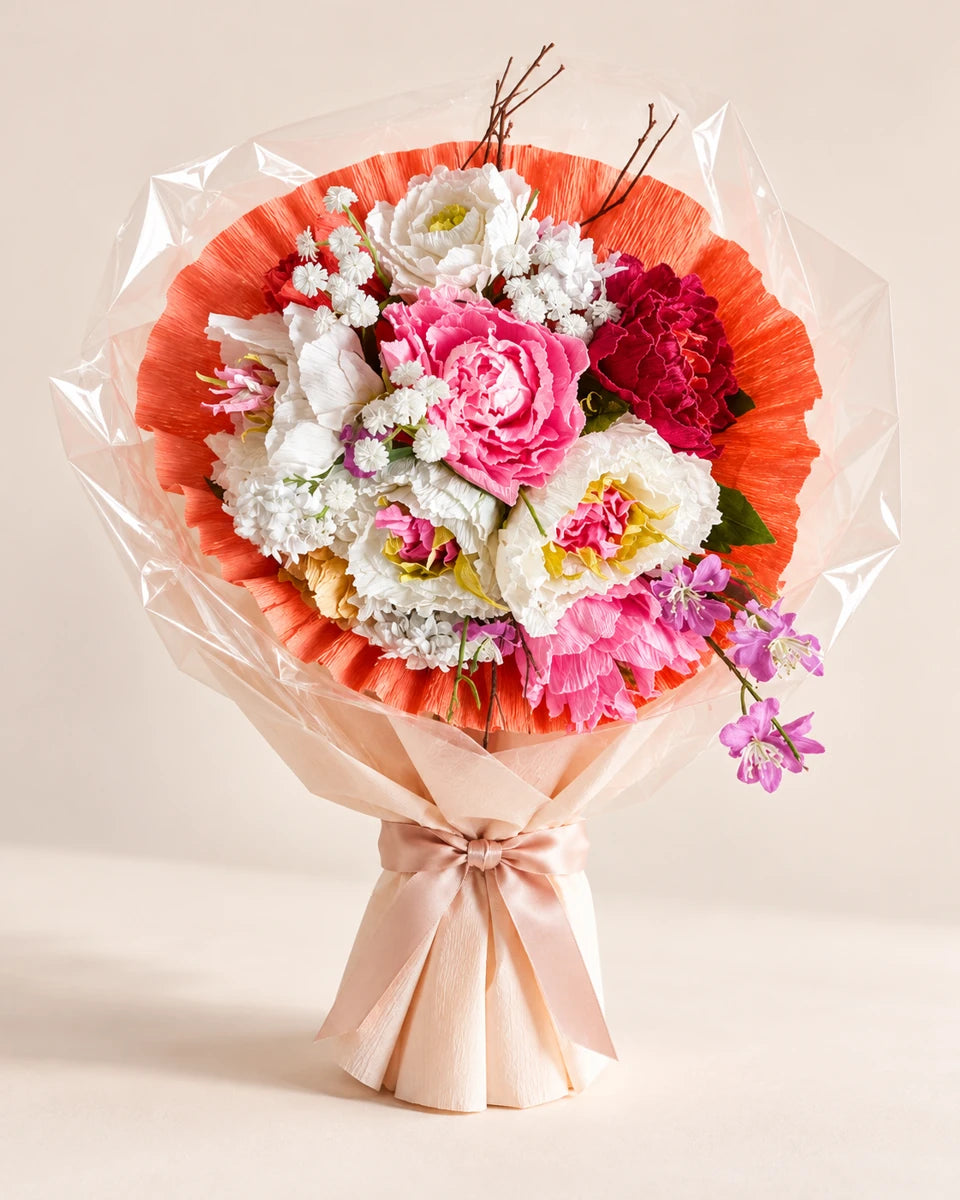 Bouquet di carta cipria e corallo in piedi, proposta di confezione con fiocco